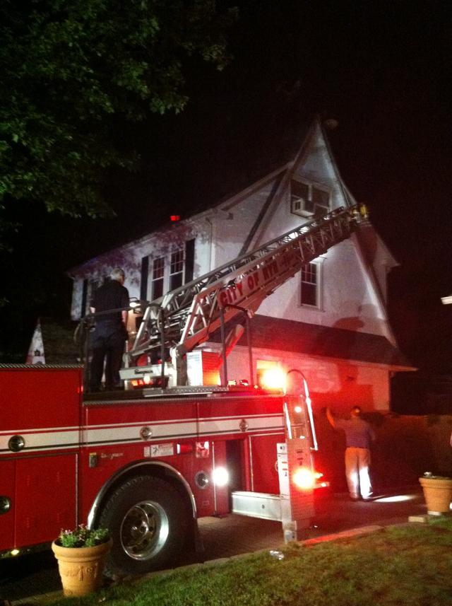 Firefighters assist PD and EMS with removing a fully immobilized patient from a third floor window 5/29/13 
